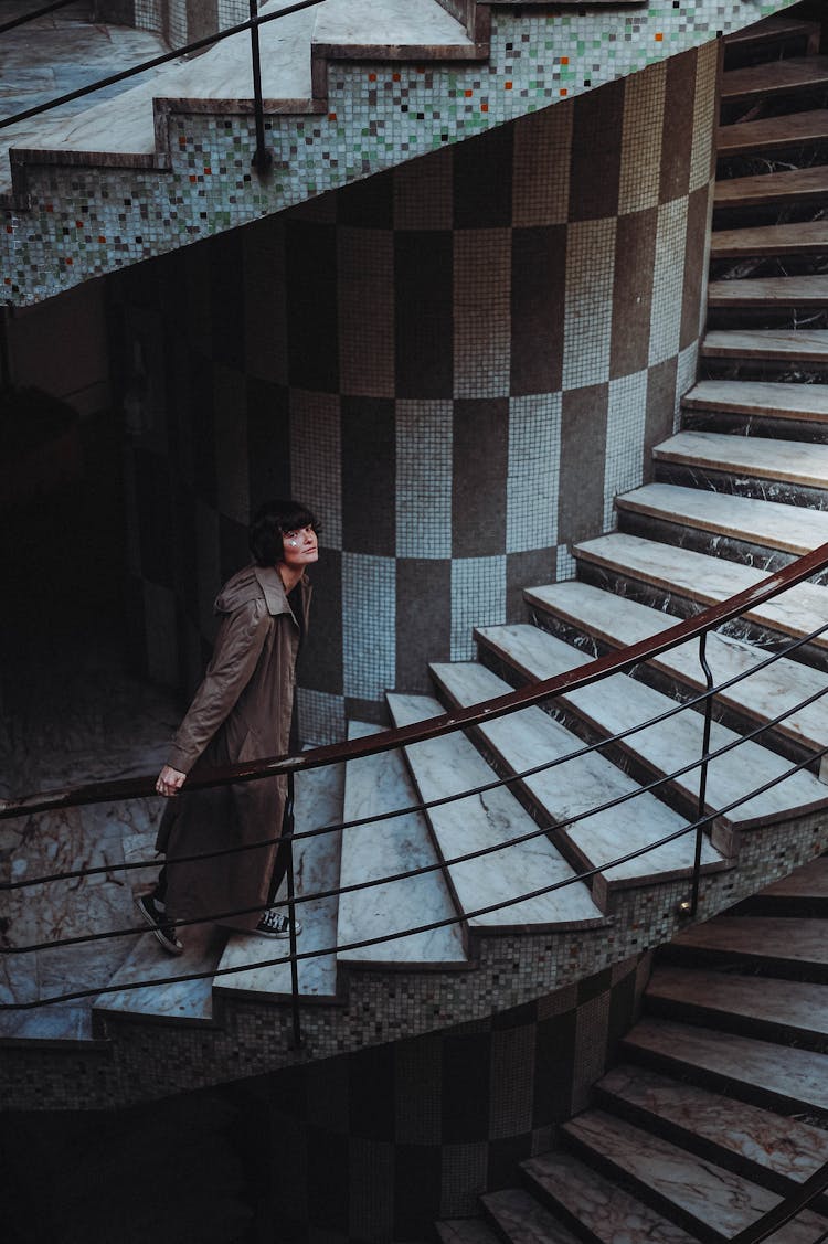 Woman Walking Swirling Staircase