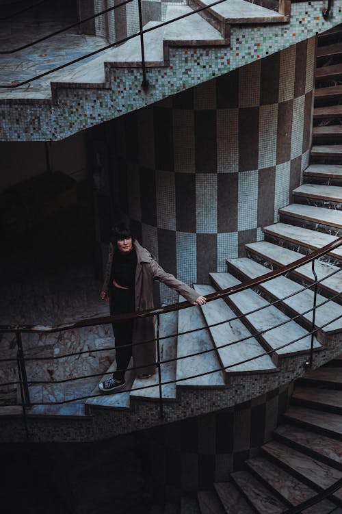 Woman in Coat on Stairs