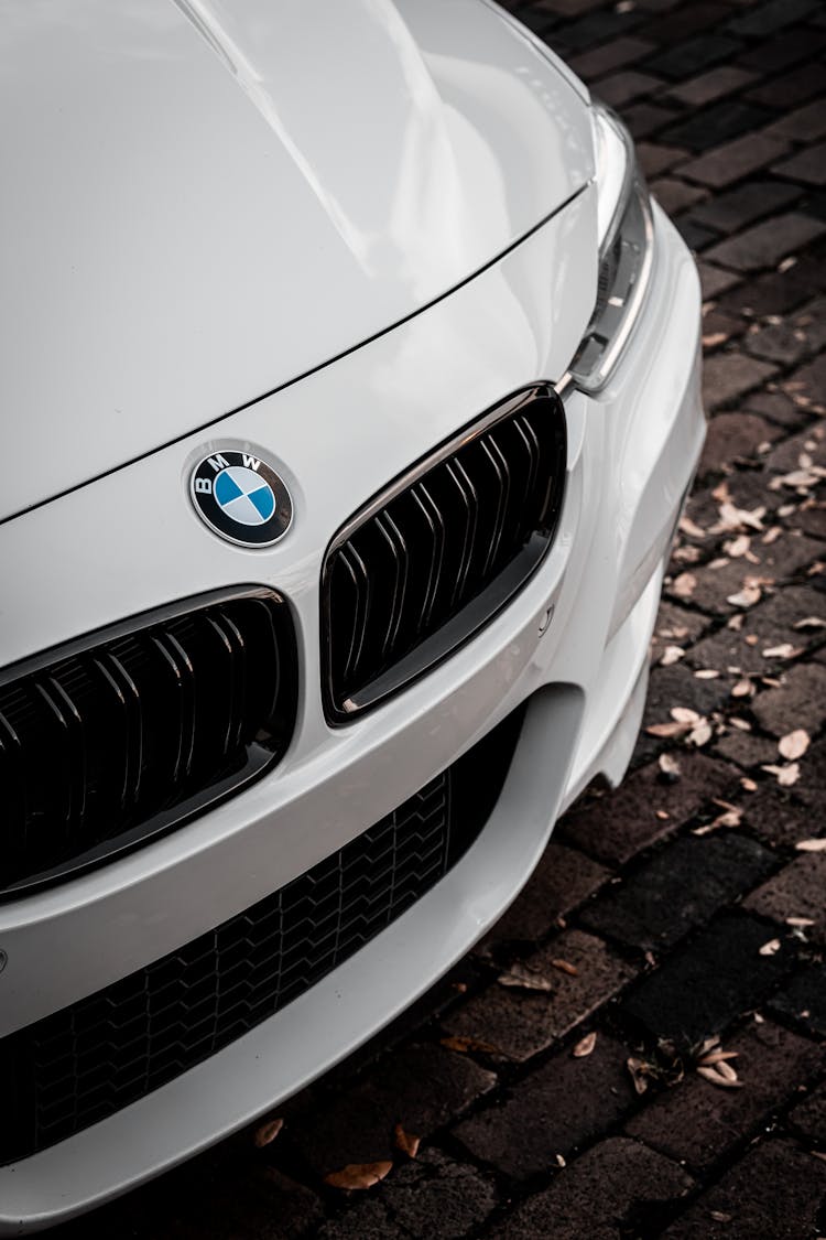 A White Luxury Car Parked On The Street