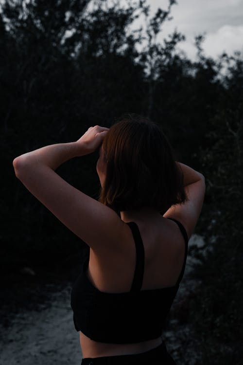 Woman in Tank Top Looking Afar