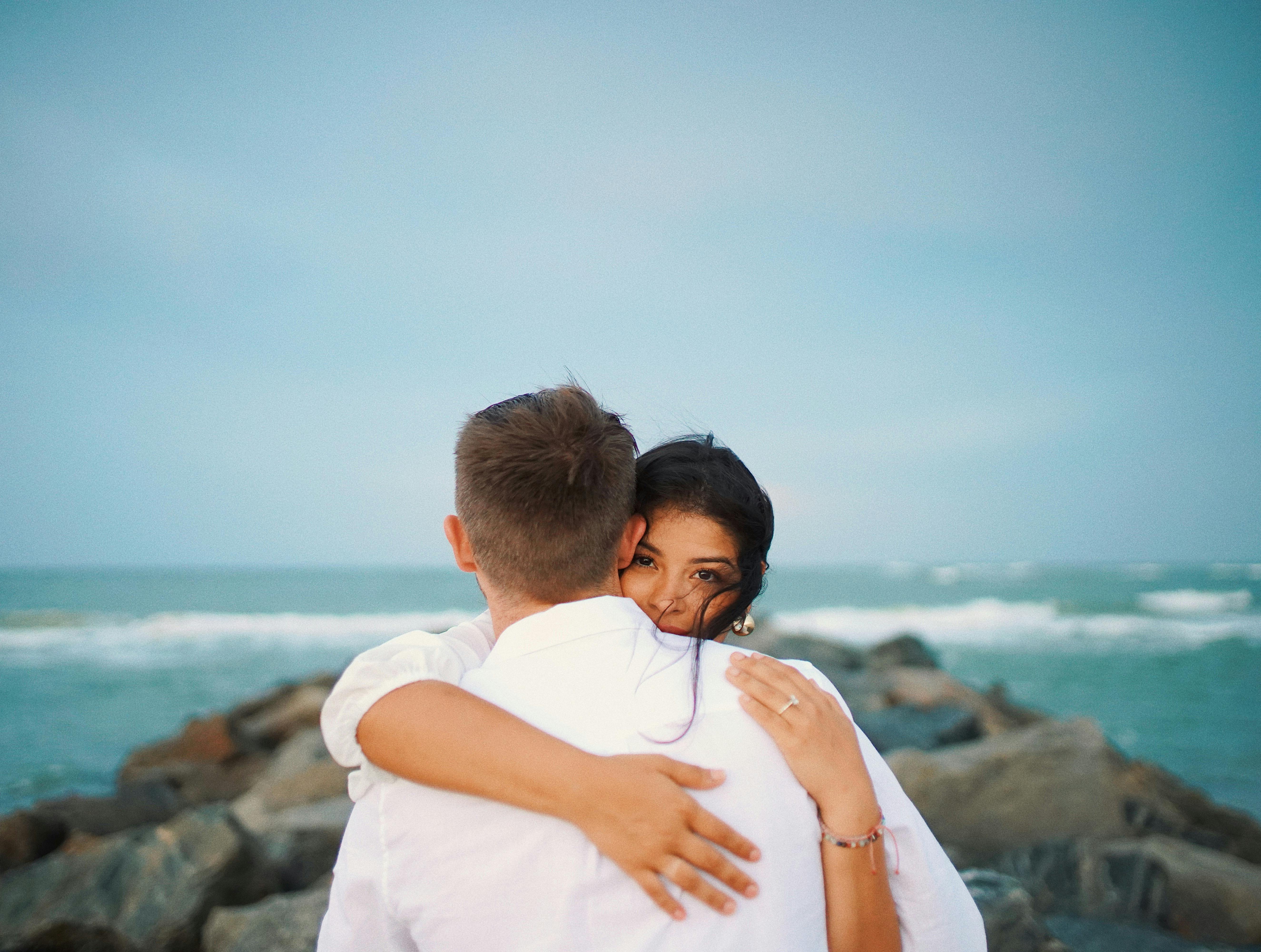 Free Couple Hugging on the Beach Stock Photo