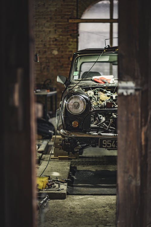 A Black Vintage Mini Cooper at an Auto Repair Shop