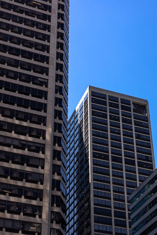 Free Low angle view of skyscrapers against a clear blue sky in downtown Philadelphia. Stock Photo