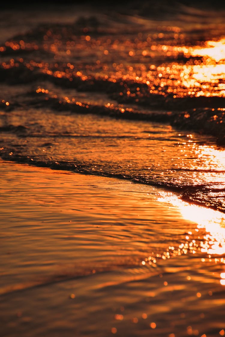 Sea Waves Overlapping At Sunset