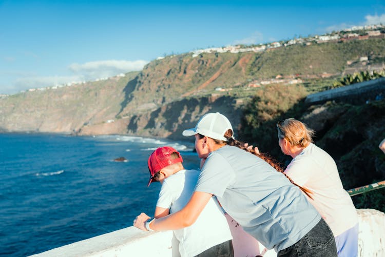 Family At A Viewing Deck Looking At The Sea