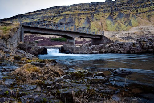 Bridge over a River in a Rocky Valley 