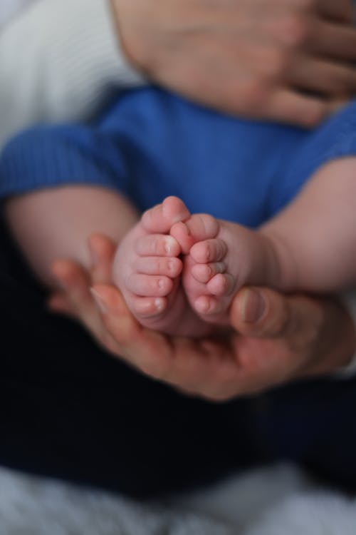 Close-up of a Parent Holding Babys Feet