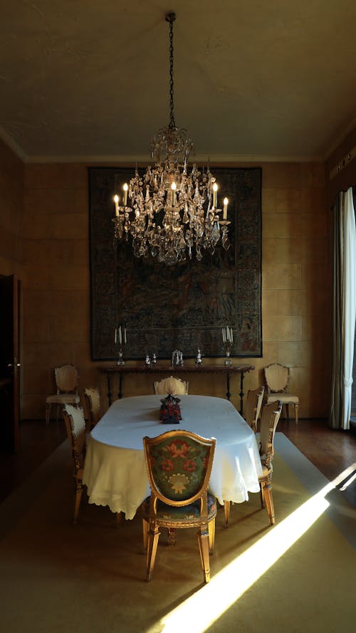 Table and Chairs in Dining Room with Chandelier