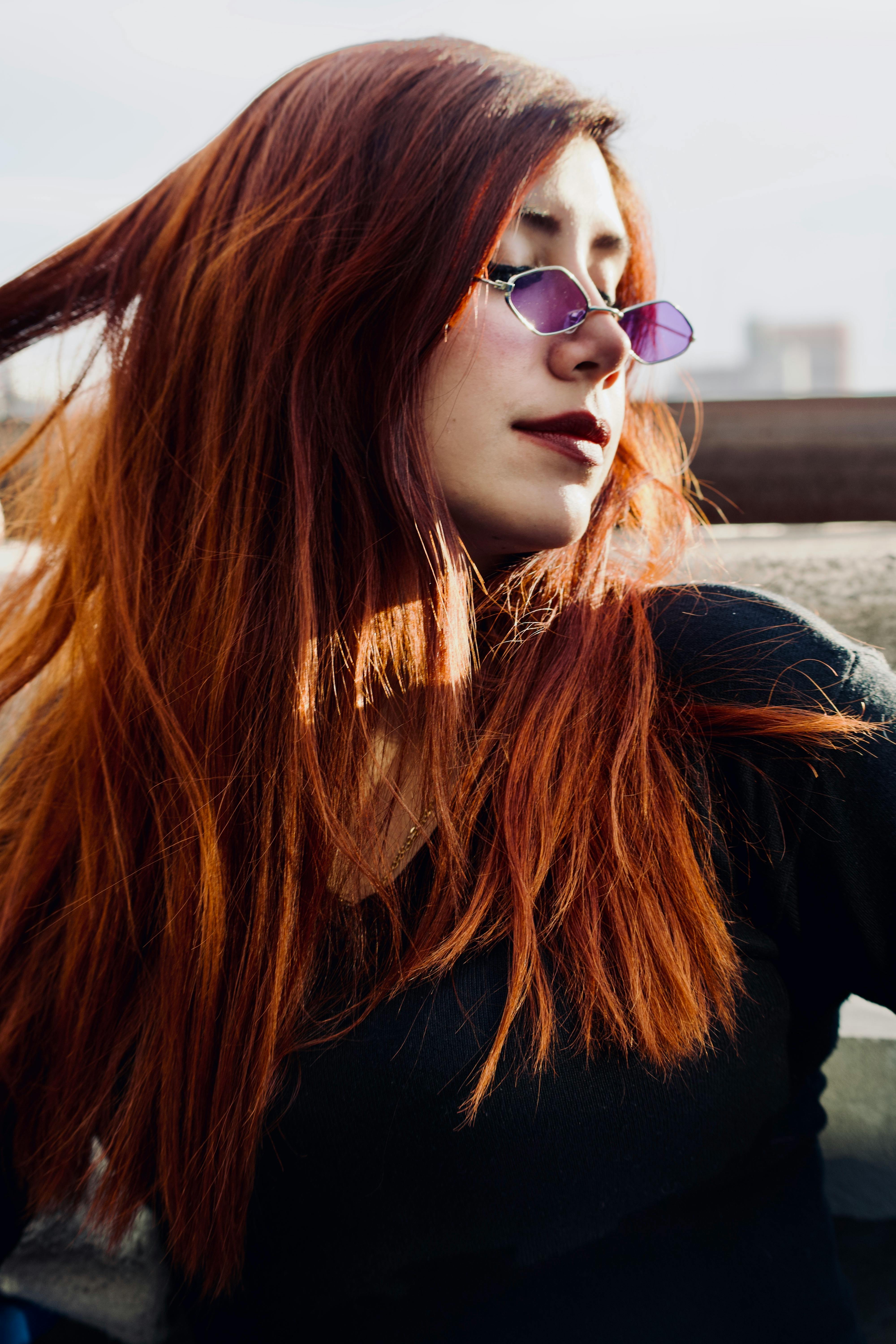 Redhead Woman behind Window · Free Stock Photo