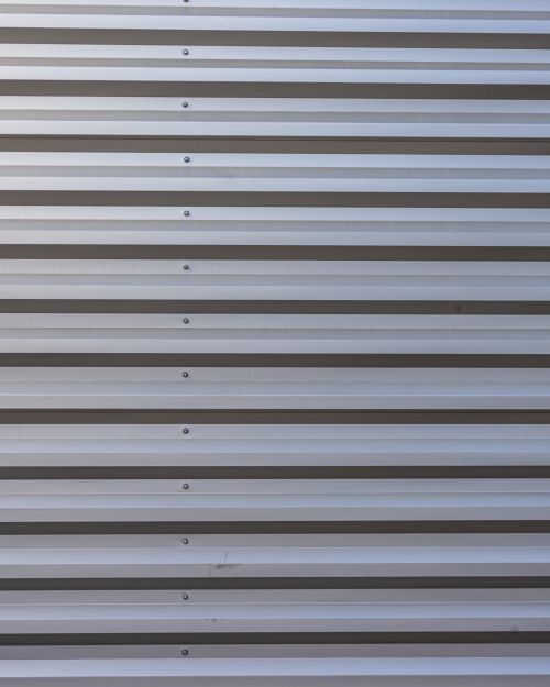 Free Detailed close-up of aluminum garage panel, showcasing its construction and texture. Stock Photo