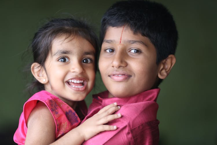 A Boy Carrying His Sister 