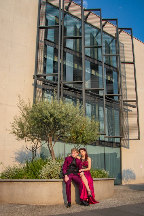 Man and Woman Sitting Beside Tree