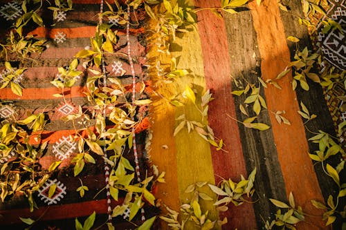 Yellow Leaves on a Colorful Fabric 