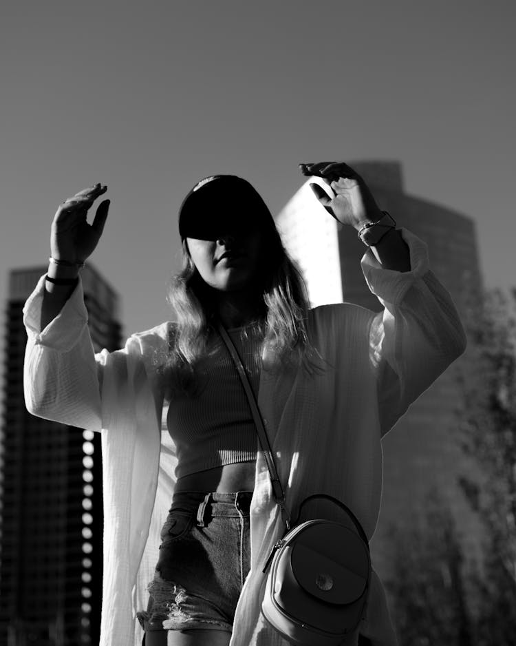 Black And White Photo Of A Girl In A City At Moonlight