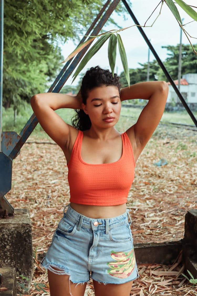 Young Woman In A Summer Outfit Posing Outdoors 