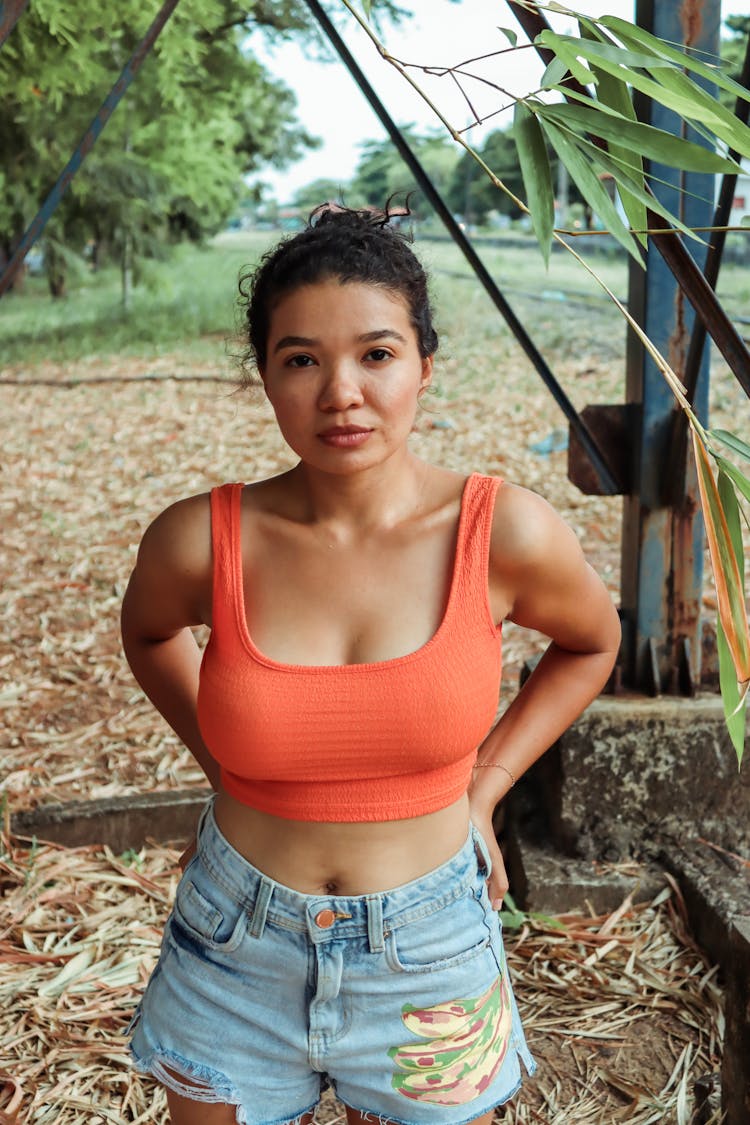 Young Woman In A Summer Outfit Posing Outdoors 