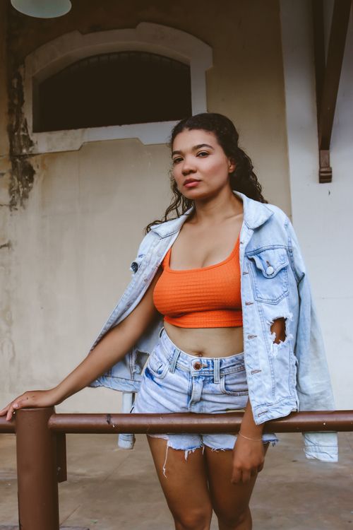 Free Young woman models summer fashion in Codó, Brazil, wearing denim and a crop top. Stock Photo