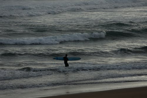 A Surfer at the Beach 