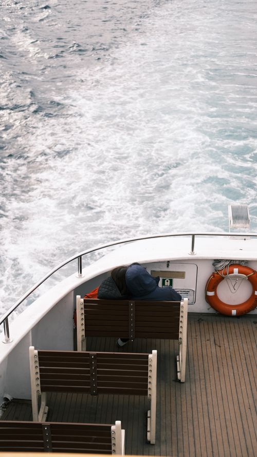 Free A serene scene of a ferry deck with a passenger in Istanbul, Turkey. Stock Photo