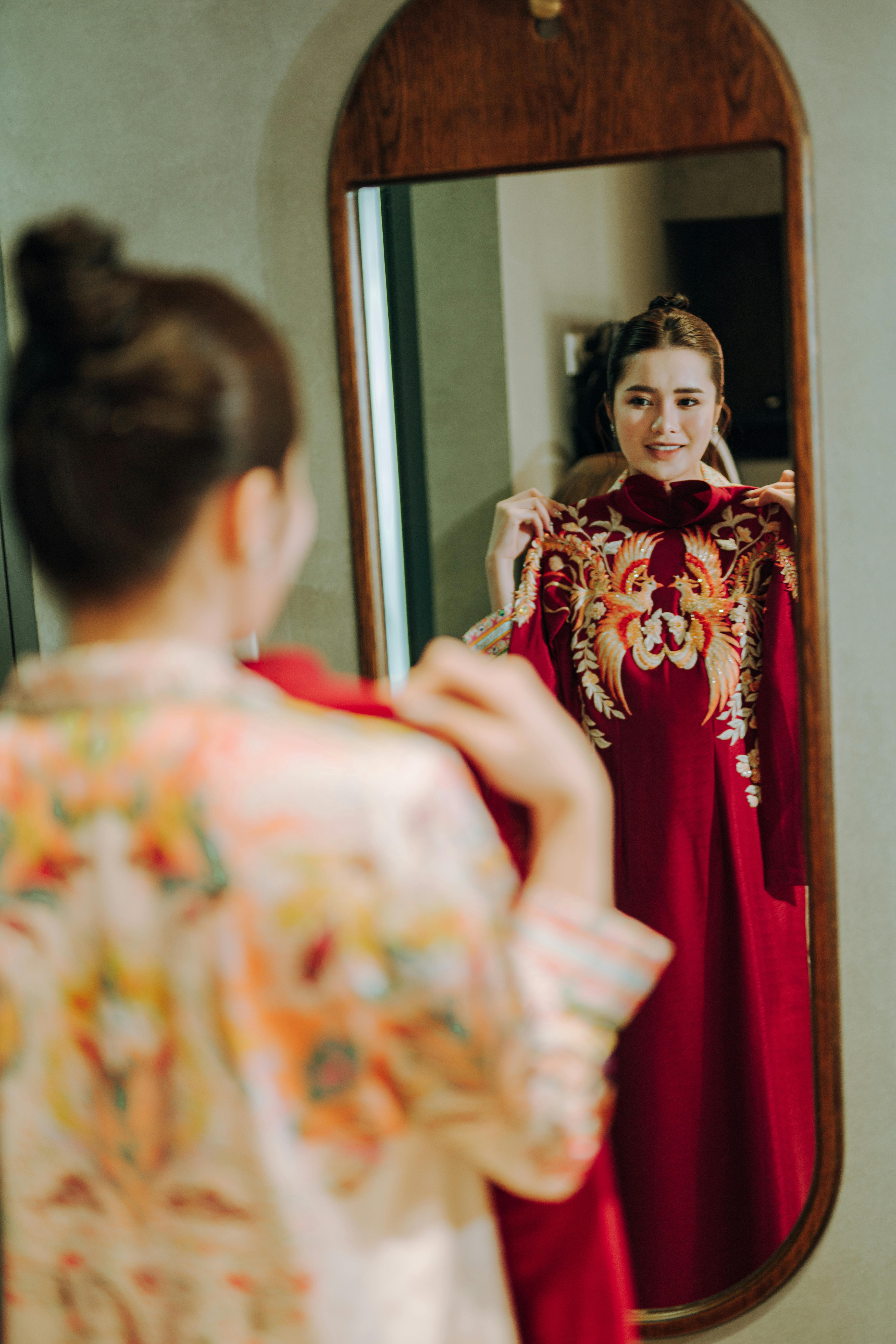 Reflection in Mirror of Woman in Red Dress · Free Stock Photo
