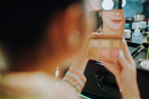 Close-up of woman applying makeup, focusing on reflection and beauty routine.