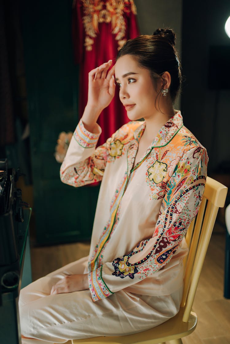 Woman Sitting And Posing On Chair