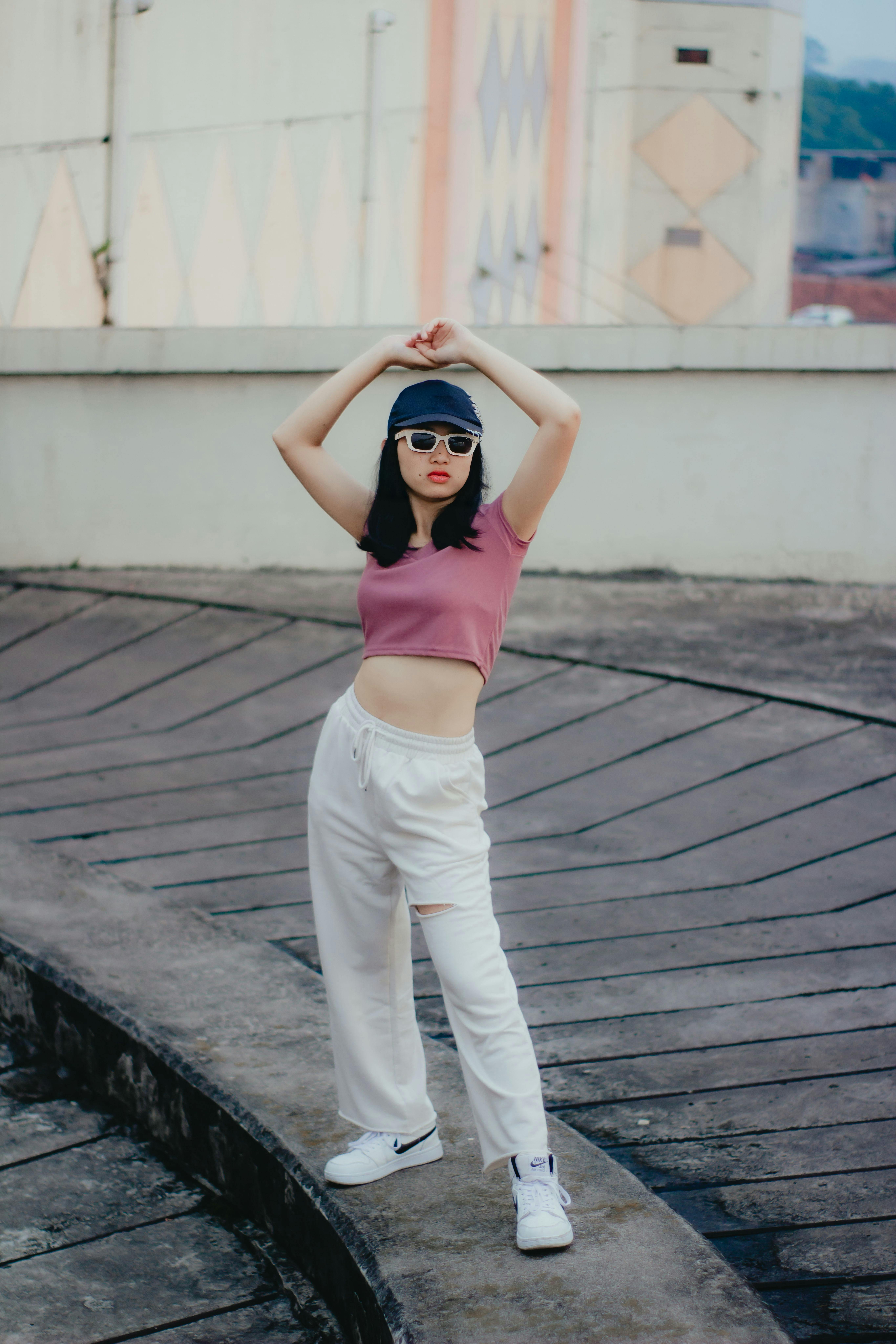 Young woman in urban setting wearing casual fashion, posing confidently in Cimahi, Indonesia.