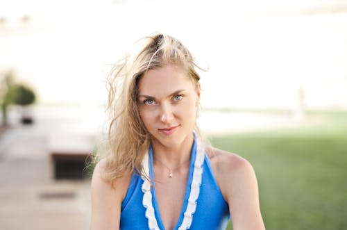 Woman Wearing White and Blue Halterneck Top