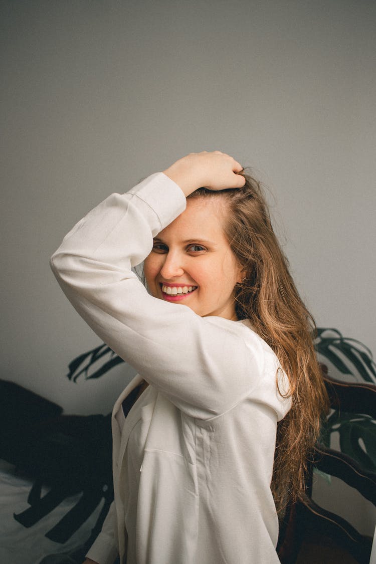 Smiling Woman Posing Touching Hair