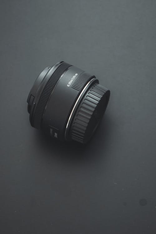 Camera Lens on Black Studio Background