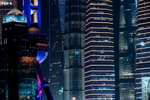 Free Night view of illuminated skyscrapers in Shanghai's cityscape showcasing modern architecture. Stock Photo
