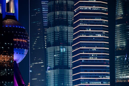 Vibrant night view of Shanghai's modern skyscrapers and the iconic Oriental Pearl Tower.