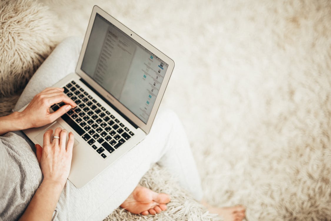 Person Holding Laptop