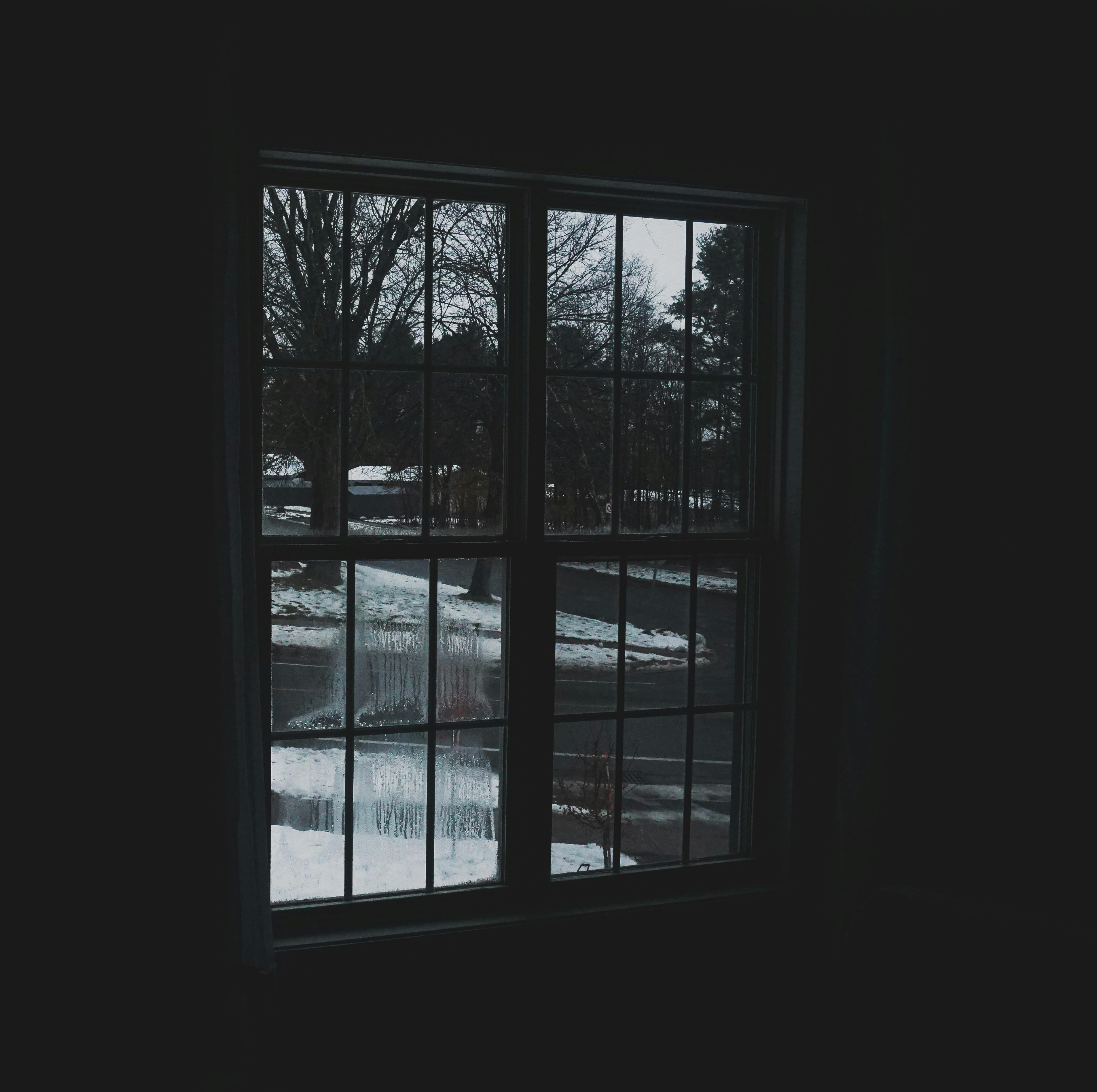 Close-up of a senior person's hand sorting pills into a travel pill organizer