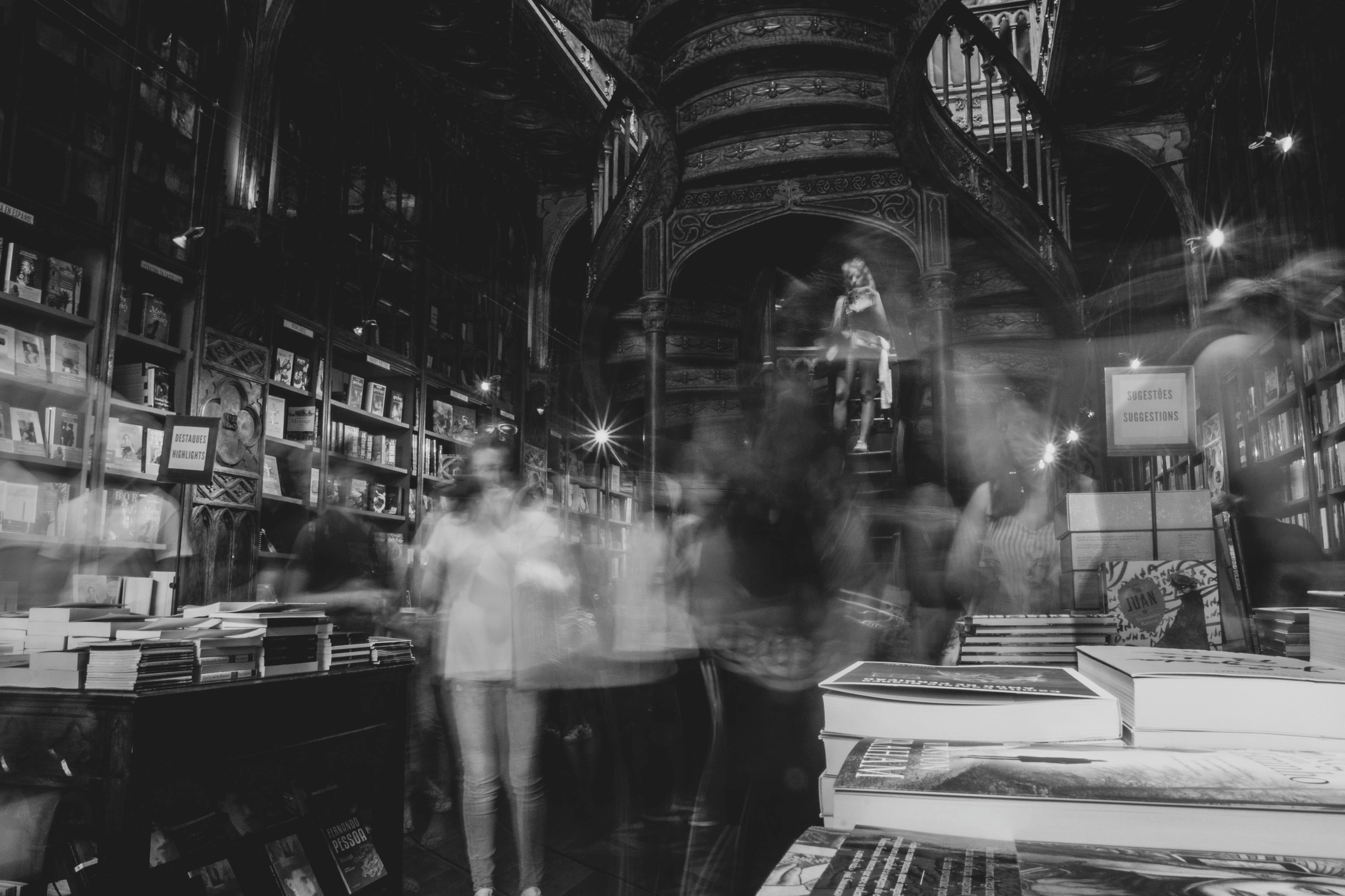 A historic bookstore in OportoPortugal with a mystical atmosphere and blurred patrons.