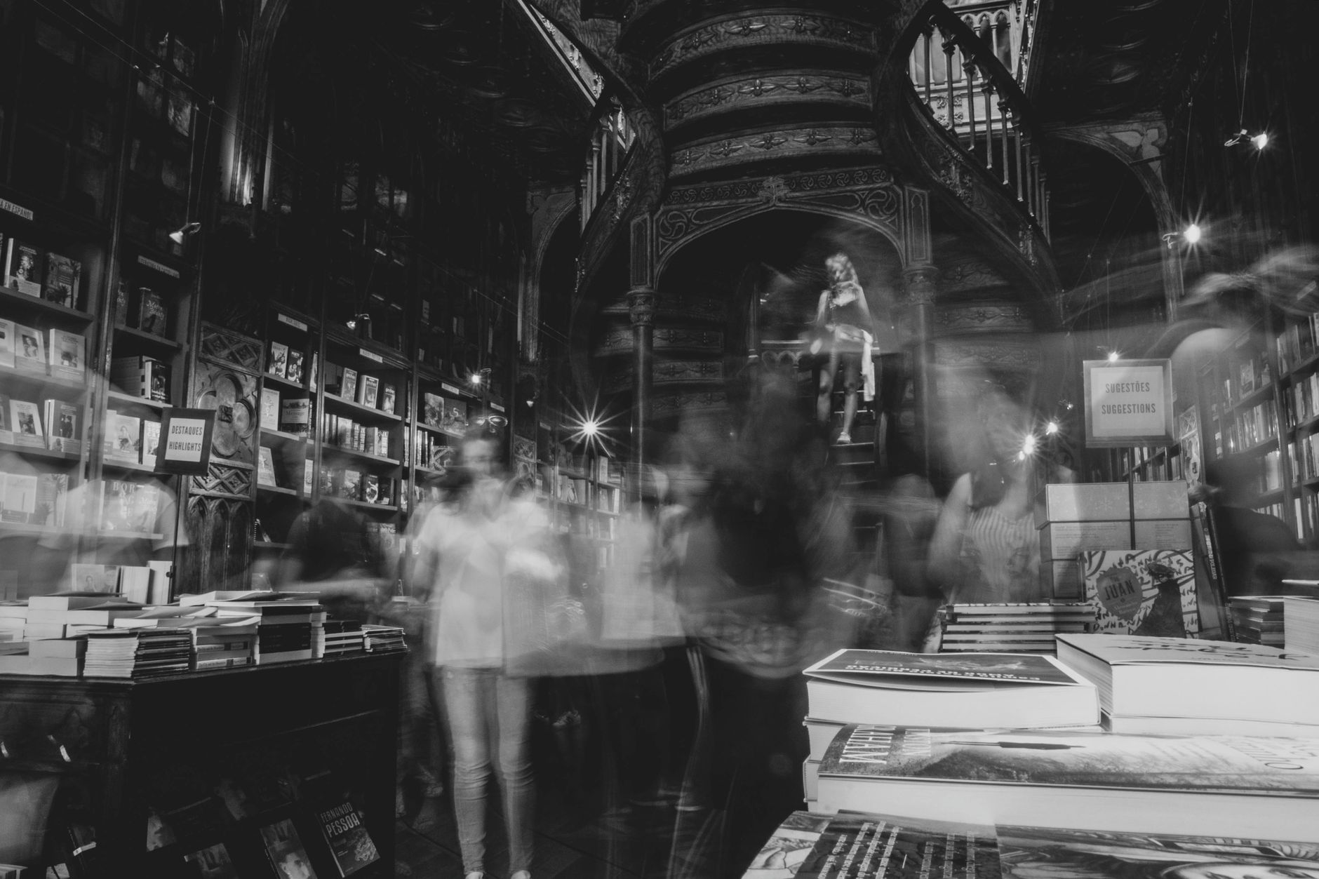 A historic bookstore in OportoPortugal with a mystical atmosphere and blurred patrons.