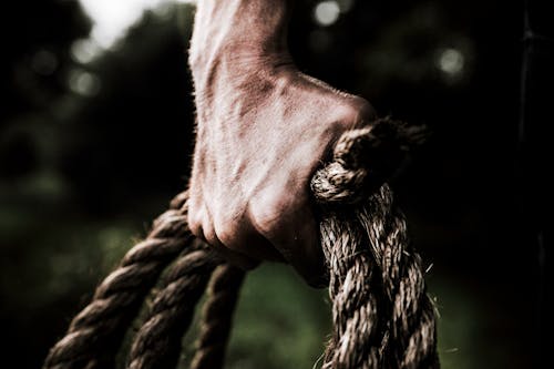 Free Man Holding Brown Rope Stock Photo