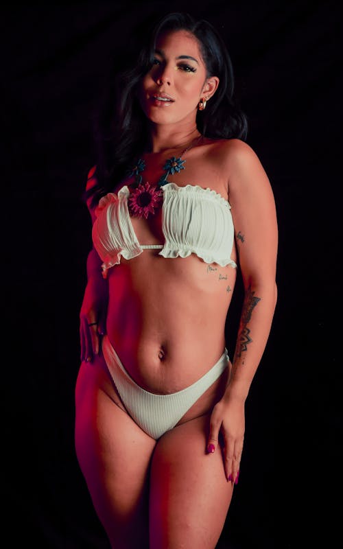 A Sexy Woman in White Bikini Posing