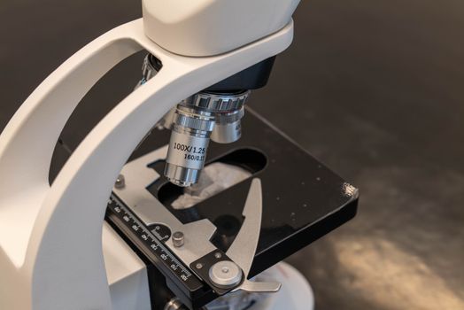 Detailed view of a laboratory microscope, essential for scientific research.