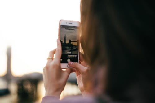 Person Taking a Photo of London Bridge