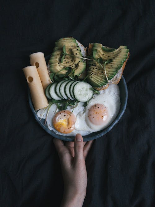 Free Close-Up Shot of a Person Holding a Breakfast Bowl Stock Photo