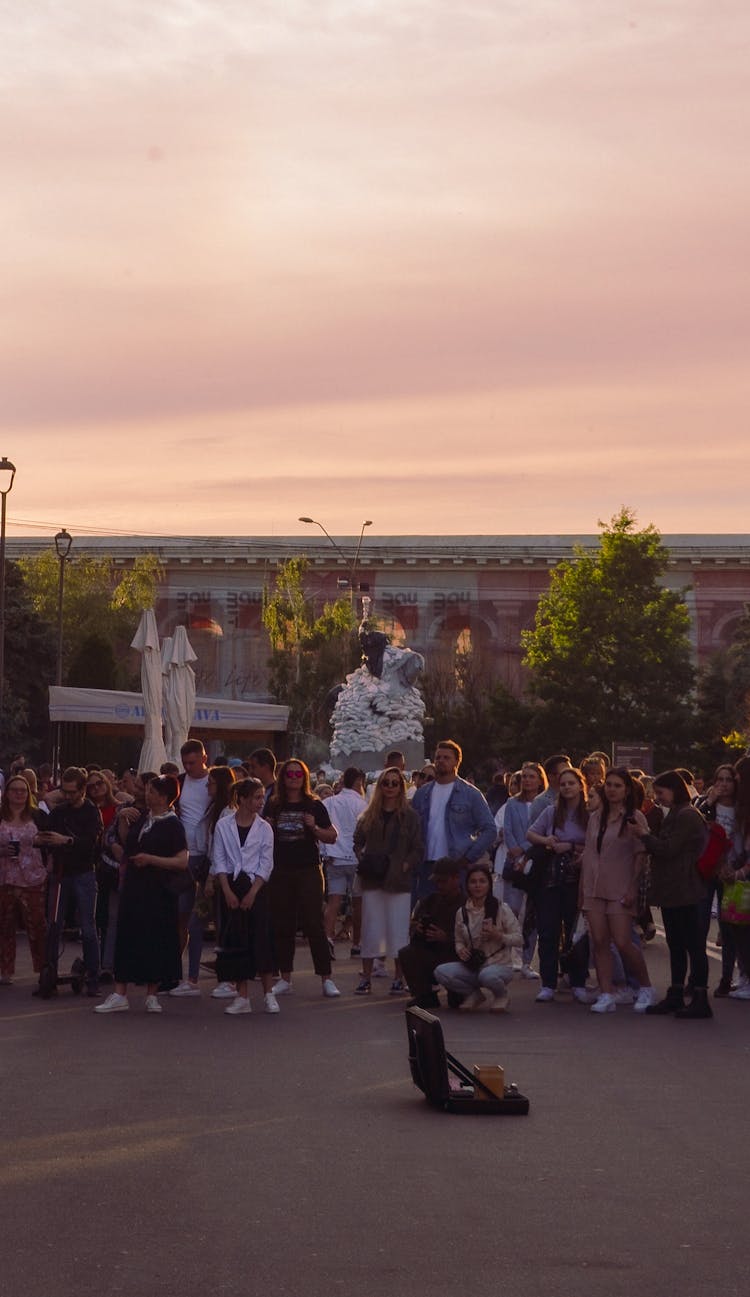 A Crowd Of People Gathering 