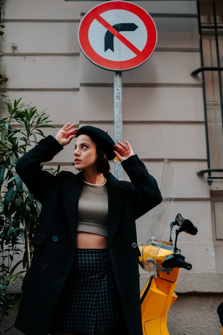 Woman Fixing Her Beret