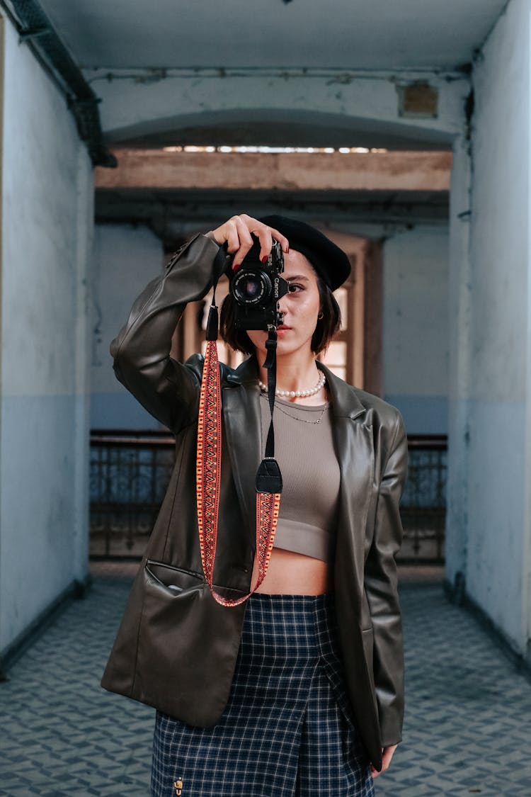 Woman In A Coat Photographing