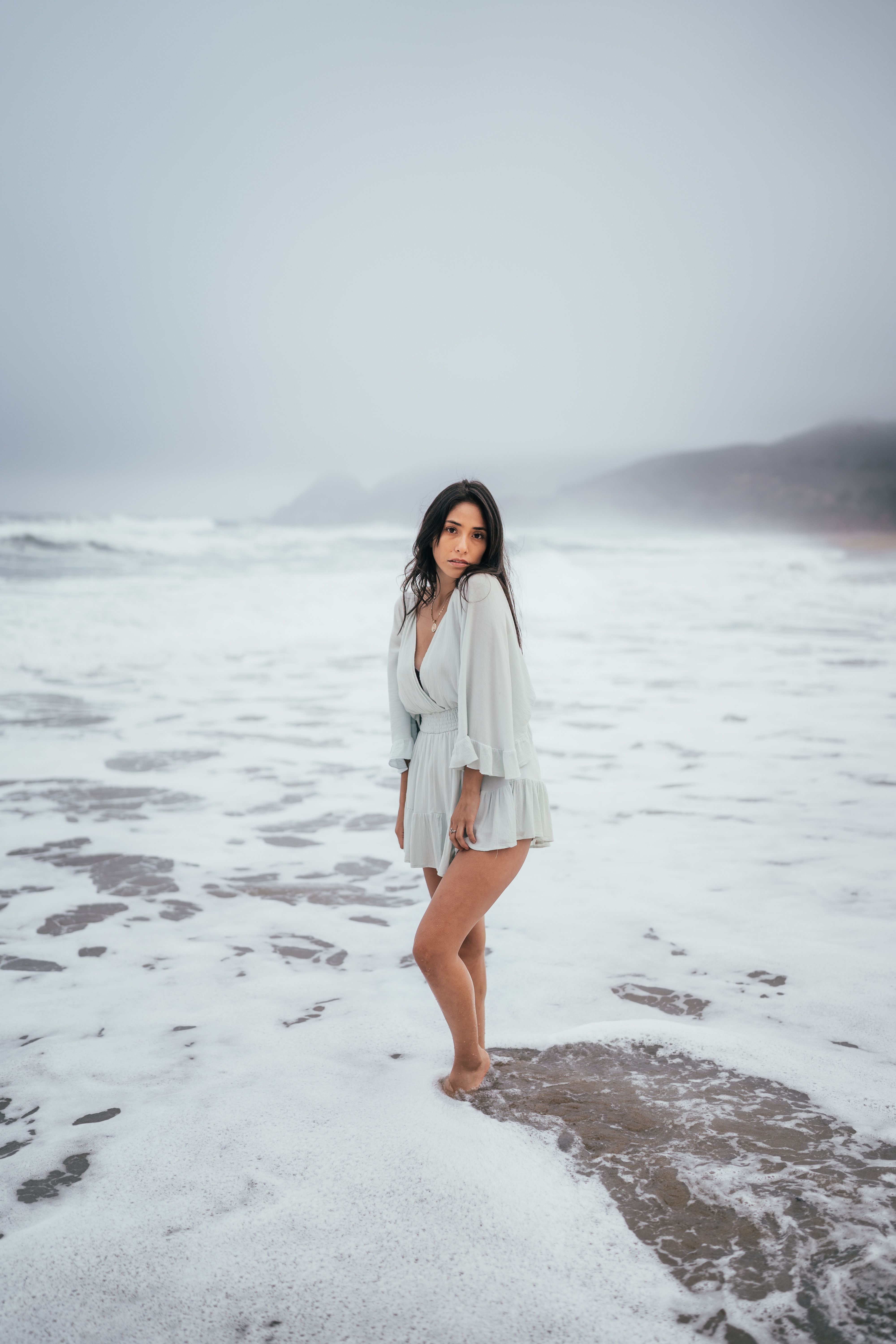 Portrait of a Woman Standing on a Beach · Free Stock Photo