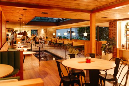 Warm timber-lined restaurant interior — photo by Jonathan Borba on Pexels