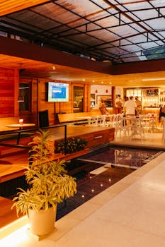 Cozy hotel dining area with wooden interior and ambient lighting, perfect for relaxation.