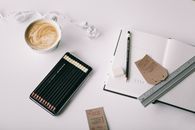 Flat Lay Photography of Grey Ruler on White Book