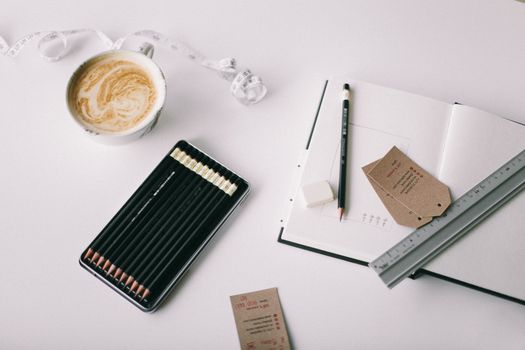 Flat Lay Photography of Grey Ruler on White Book
