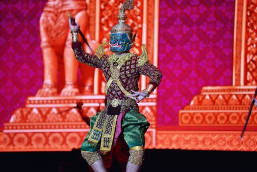 Colorful traditional Khmer dance performance with intricate costume and mask in Phnom Penh, Cambodia.